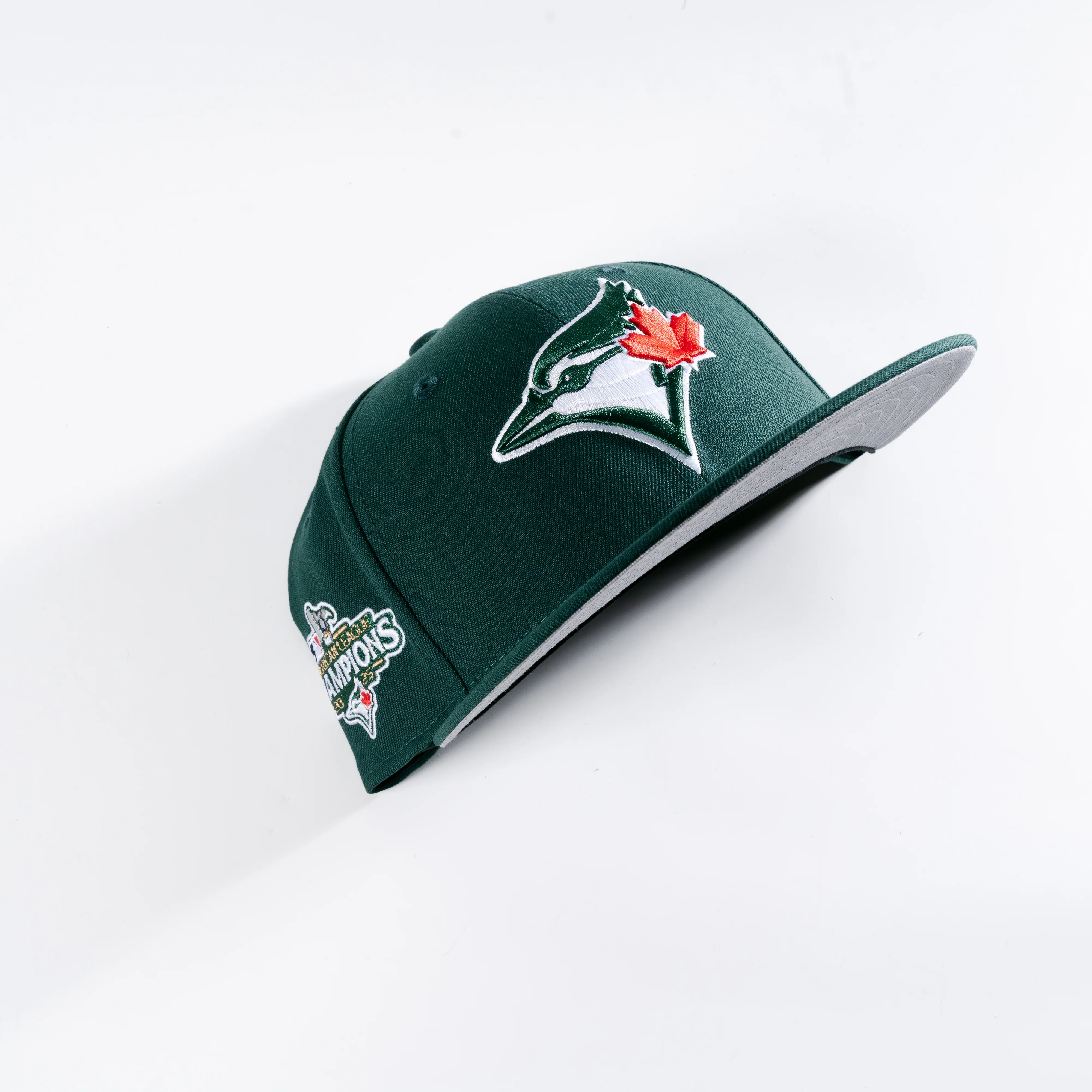 TORONTO BLUE JAYS 2025 AMERICAN LEAGUE CHAMPIONS DARK GREEN 59FIFTY FITTED HAT